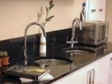 black granite worktop with inset sinks